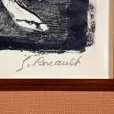Signature manuscrite "G. Rouault" sur une estampe encadrée.