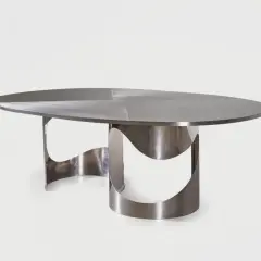 Table design by Maria Pergay, en métal brossé, aux formes organiques et sculpturales.