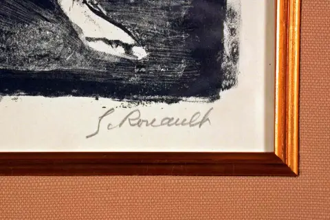 Signature manuscrite "G. Rouault" sur une estampe encadrée.