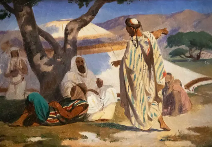 Scène orientale peinte par Prosper Marilhat. Des personnages en habits traditionnels discutent sous un arbre, dans un paysage désertique.