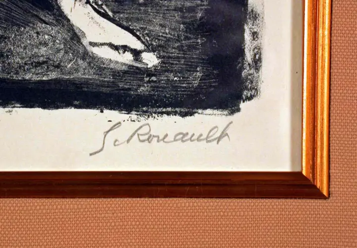 Signature manuscrite "G. Rouault" sur une estampe encadrée.