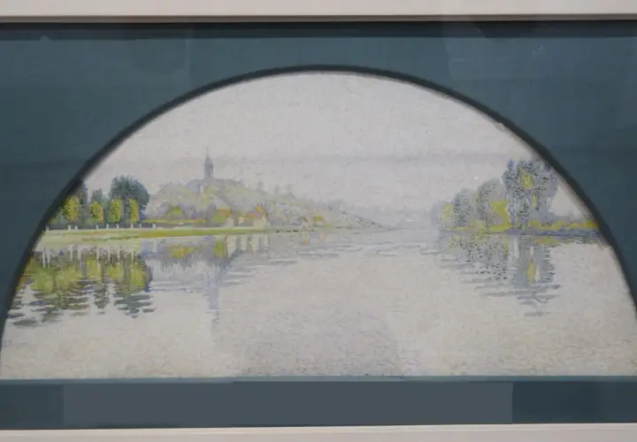 Paysage fluvial impressionniste, évoquant une "manzana Pissarro" par ses touches de lumière et ses reflets sur l'eau.