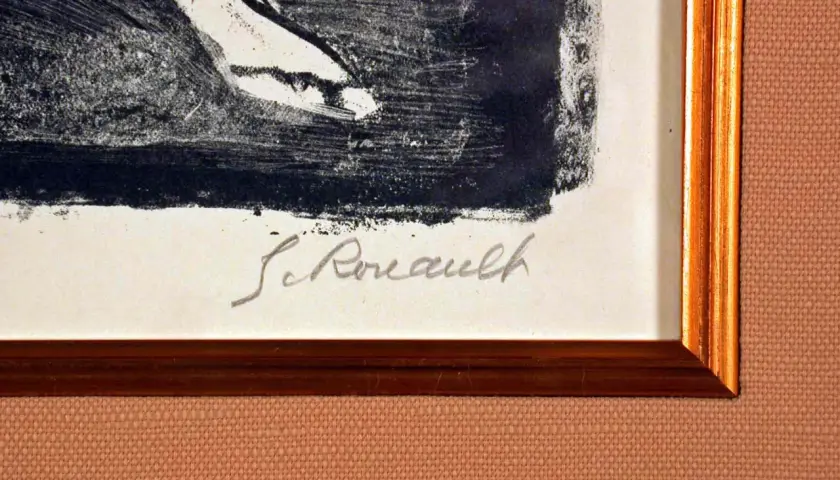 Signature manuscrite "G. Rouault" sur une estampe encadrée.