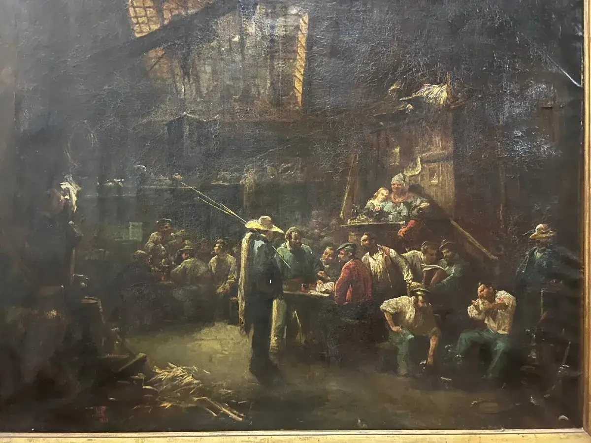 Une scène de taverne animée par Hippolyte Lazerges, où des hommes discutent et boivent dans une ambiance sombre et chaleureuse.