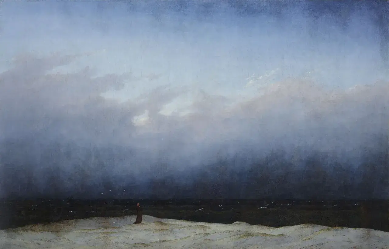 Une figure solitaire contemple la mer agitée sous un ciel menaçant, une scène typique des œuvres d'art de Caspar David Friedrich.